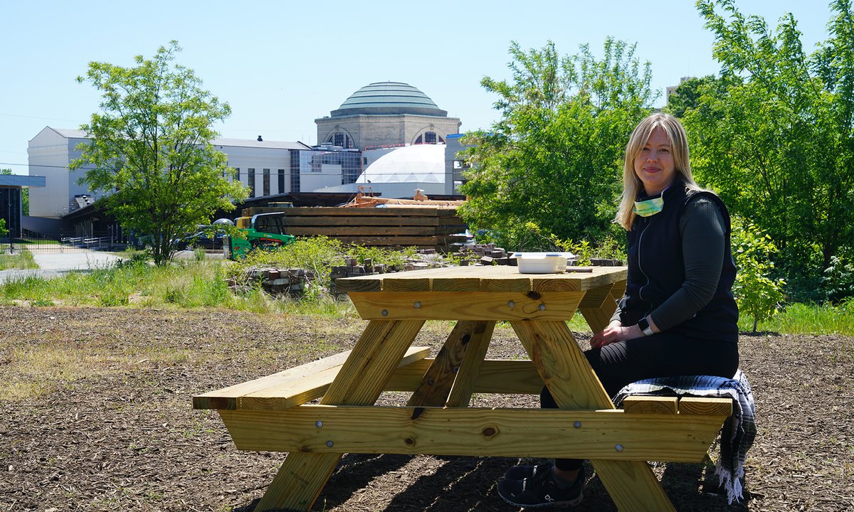 female sitting at a picnic table.jpg