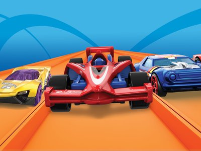 Hot Wheels art featuring a yellow, red, blue, and orange car preparing to race down an orange track