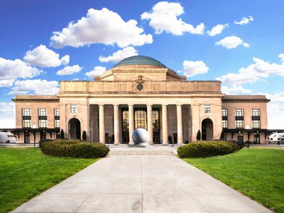 Exterior shot of Science Museum during the day.