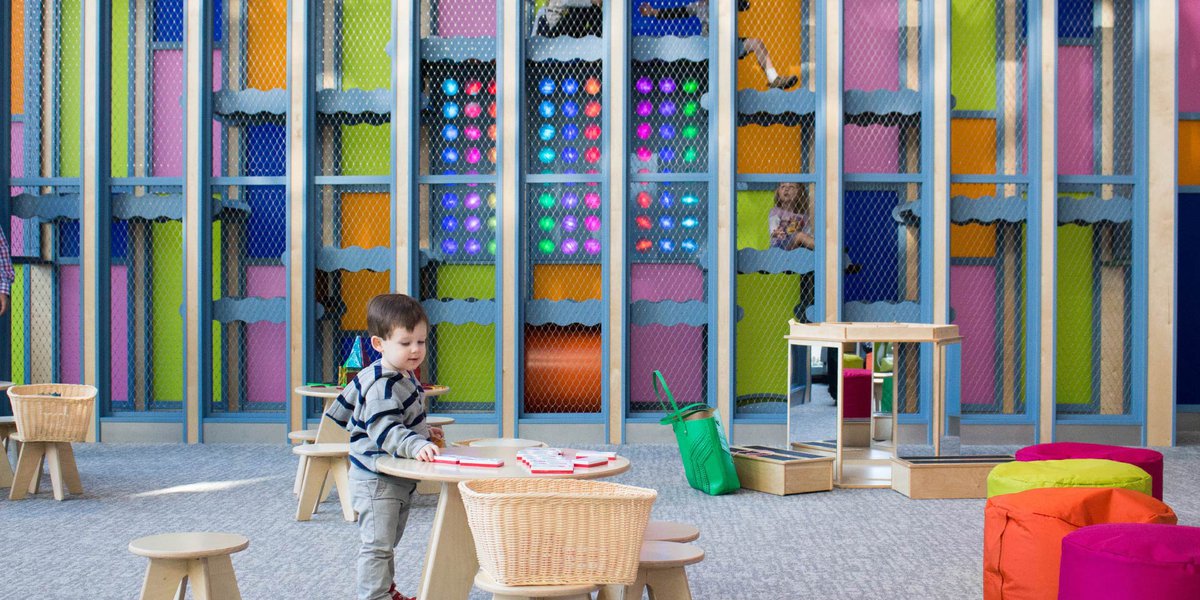 A child playing at a table in Light Place.