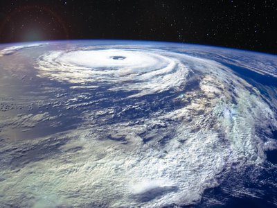 A hurricane moving over the ocean.