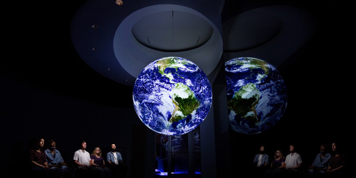 Guest watching the Earth in Science on a Sphere.