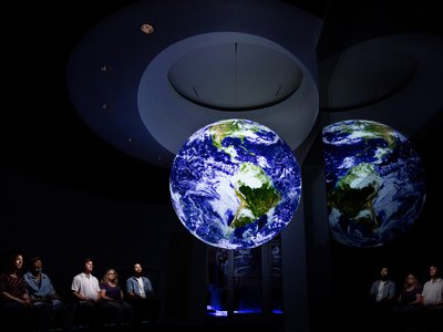 Guest watching the Earth in Science on a Sphere.